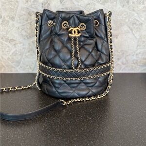 CHANEL Lambskin Quilted Chain Bucket Drawstring Bag – Black with Gold Hardware